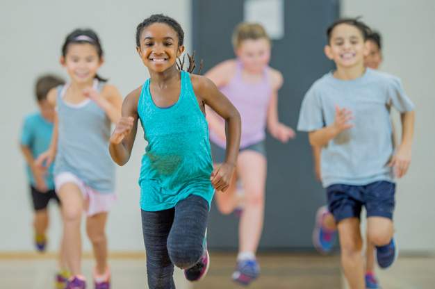 Children running PE class